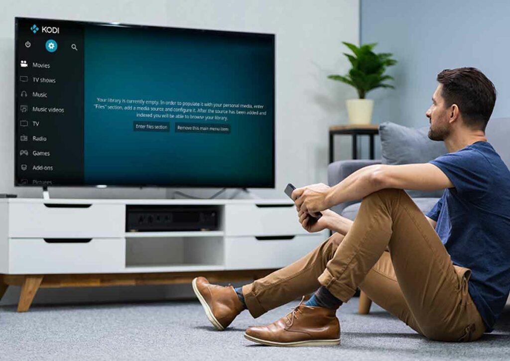 Man watching TV with Kodi