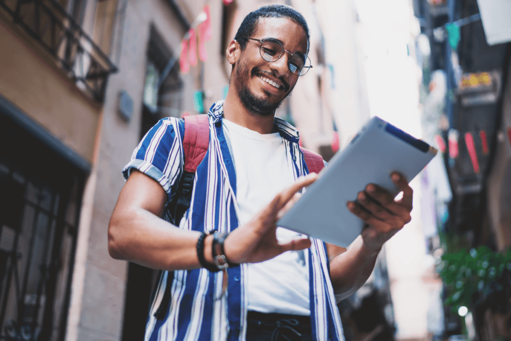 man uses tablet with vpn for travel