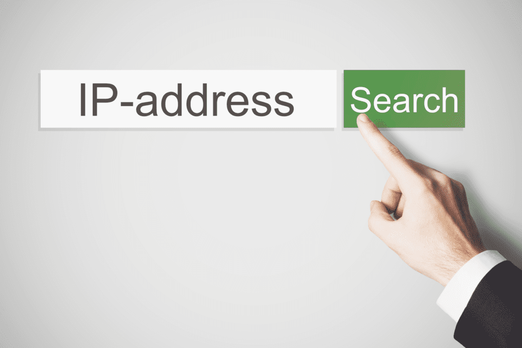 Art depicting a search of the phrase IP-address with a hand pointing to the "Search" button