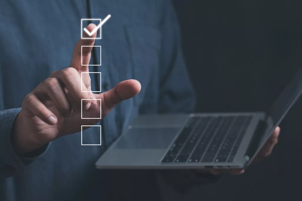 person holding laptop voting