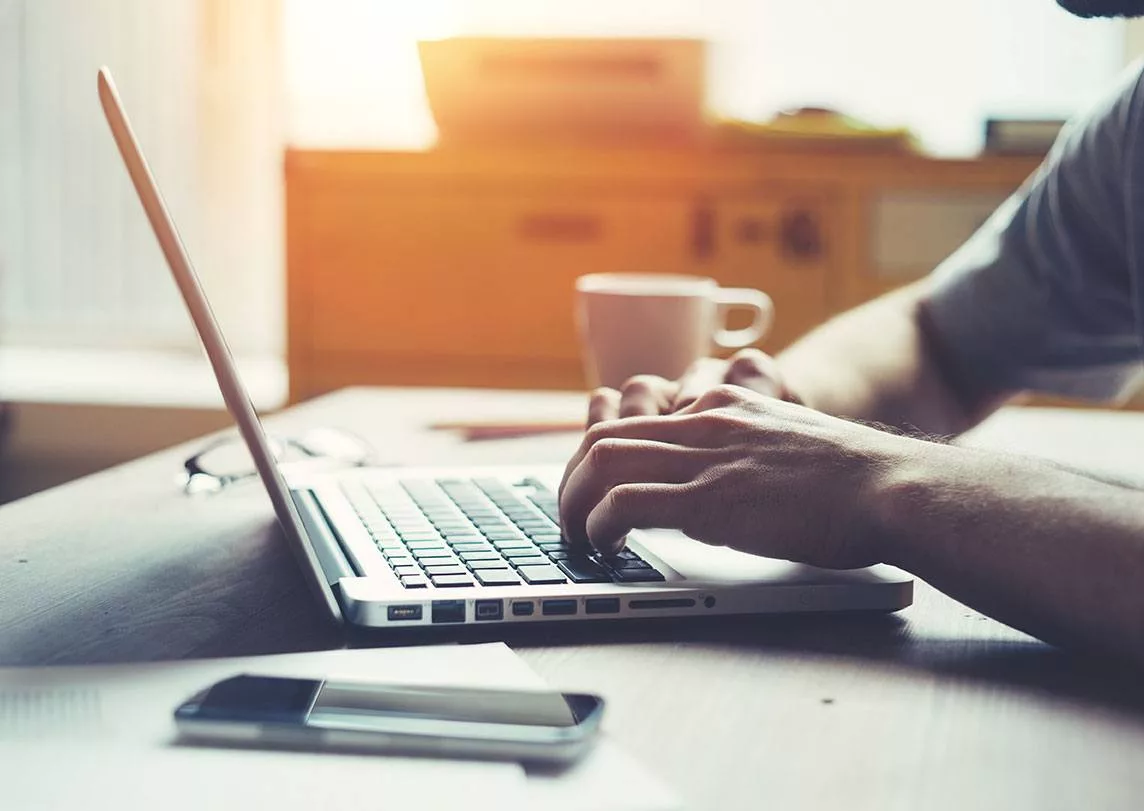 Man typing on keyboard